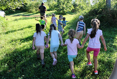 kidswalkingthruthegardenholdinghands